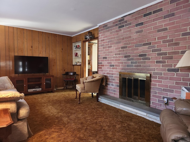 carpeted living room featuring wooden walls, ornamental molding, and a fireplace