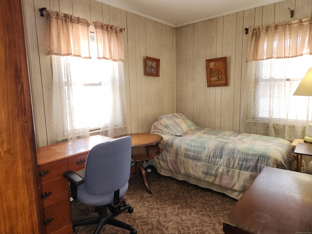 carpeted bedroom with ornamental molding and multiple windows