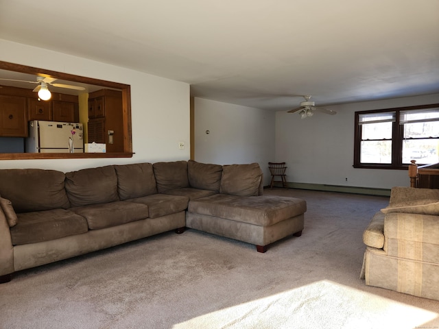 carpeted living room featuring ceiling fan and baseboard heating