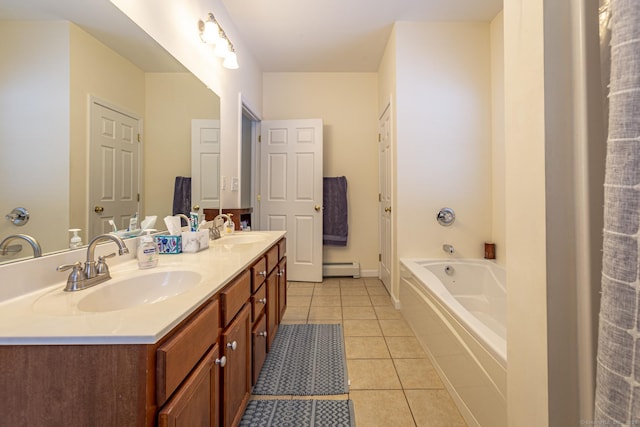 bathroom featuring baseboard heating, tile patterned floors, vanity, and a tub