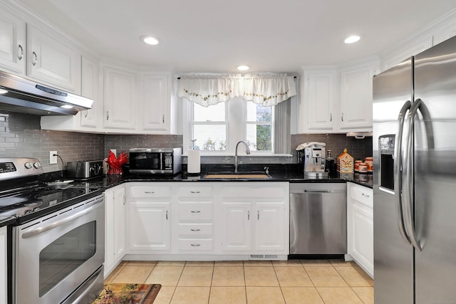 kitchen featuring white cabinetry, light tile patterned floors, stainless steel appliances, and sink