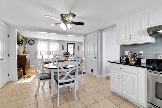 dining area with light tile patterned floors and ceiling fan