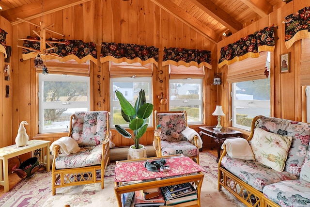 sunroom / solarium featuring vaulted ceiling with beams, wood ceiling, and a healthy amount of sunlight