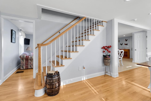 stairway with wood-type flooring