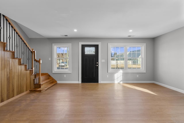 foyer entrance with light hardwood / wood-style flooring