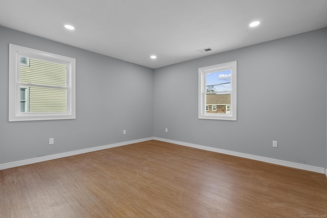 spare room with light wood-type flooring