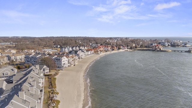 birds eye view of property featuring a water view and a view of the beach