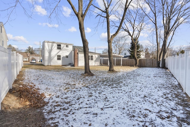 view of yard covered in snow