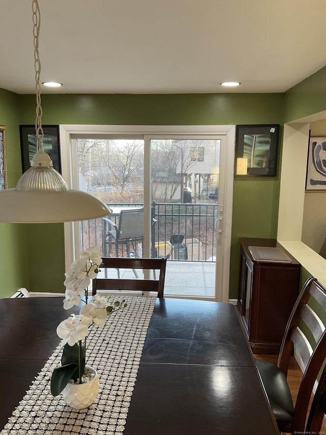 dining area with dark hardwood / wood-style floors