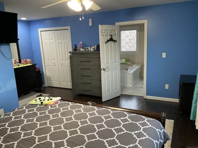 bedroom featuring ceiling fan, dark hardwood / wood-style flooring, and a closet