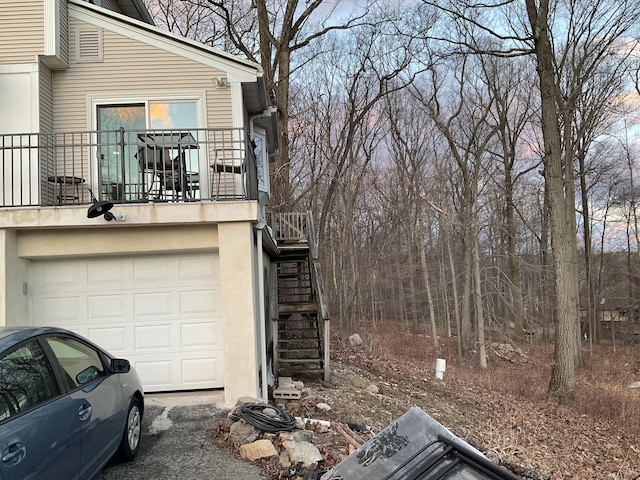 view of side of property with a garage