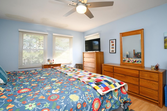 bedroom featuring ceiling fan and light hardwood / wood-style floors