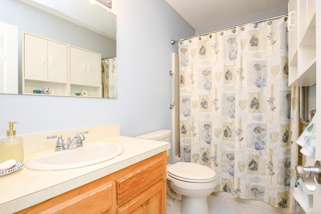 bathroom with vanity, curtained shower, tile patterned floors, and toilet