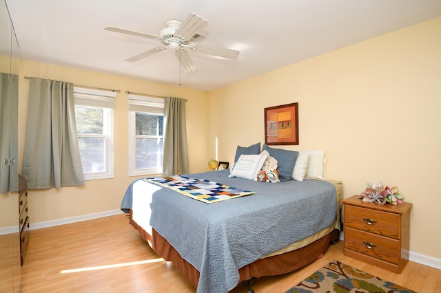 bedroom with ceiling fan and light wood-type flooring