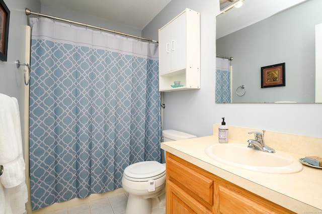 bathroom featuring vanity, toilet, and tile patterned flooring