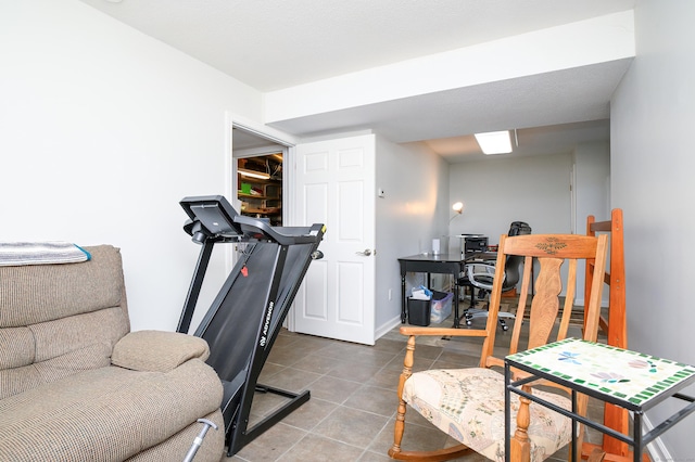 workout area with tile patterned flooring