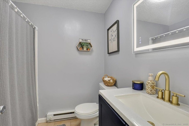 bathroom with a baseboard radiator, vanity, toilet, and a textured ceiling