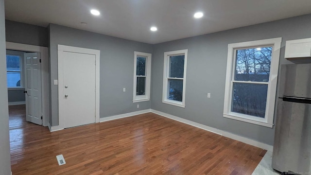 empty room with wood-type flooring