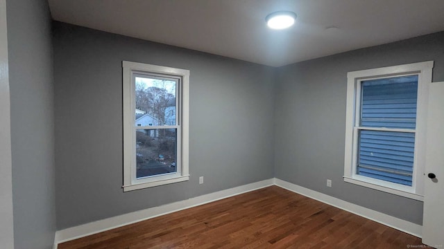 unfurnished room featuring wood-type flooring