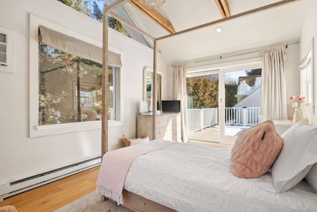 bedroom featuring multiple windows, access to exterior, a baseboard radiator, and lofted ceiling