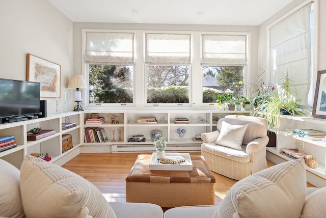 sunroom / solarium featuring a baseboard radiator