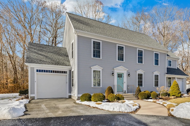 colonial-style house featuring a garage