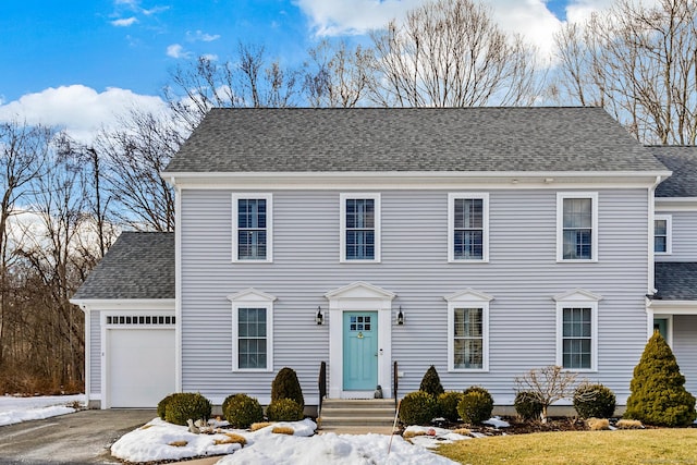 colonial inspired home featuring a garage