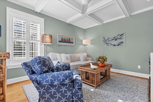 living room featuring beamed ceiling, wood-type flooring, coffered ceiling, and a wealth of natural light