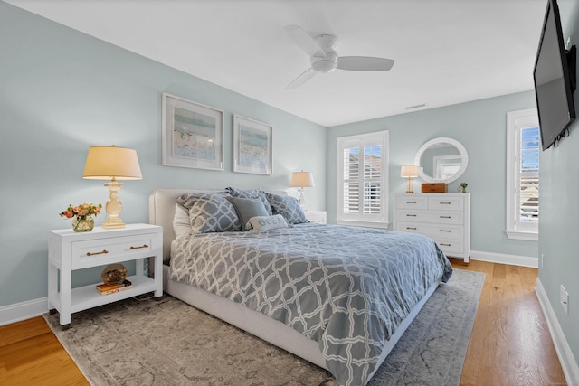 bedroom featuring wood-type flooring and ceiling fan