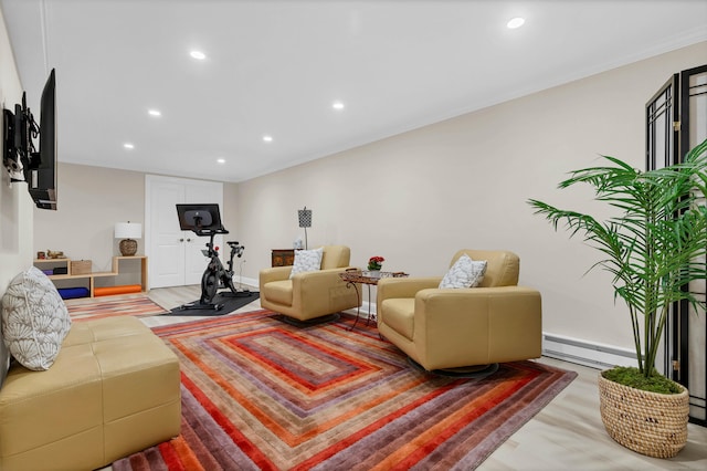 living room featuring crown molding, hardwood / wood-style floors, and baseboard heating