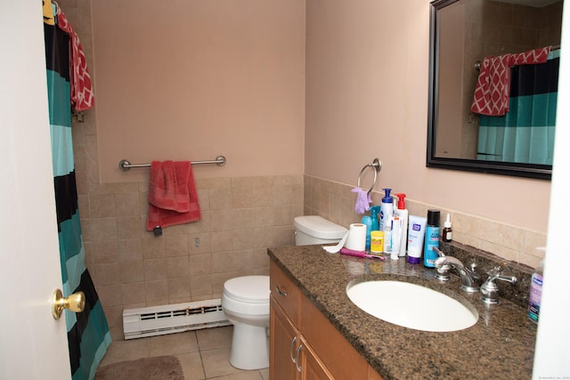 bathroom featuring tile walls, tile patterned flooring, vanity, a baseboard heating unit, and toilet