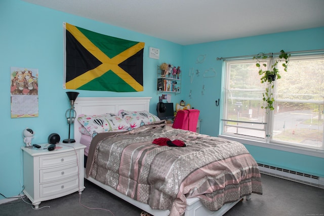 carpeted bedroom with baseboard heating and multiple windows