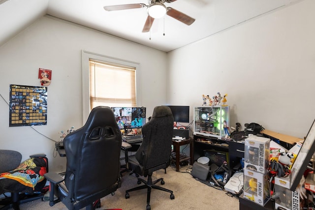 carpeted office featuring lofted ceiling and ceiling fan