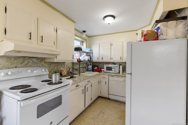 kitchen with sink, backsplash, white cabinets, light tile patterned floors, and white appliances