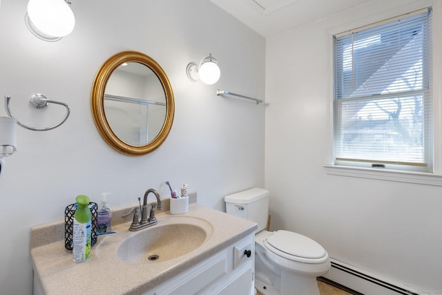 bathroom with vanity, a baseboard radiator, and toilet