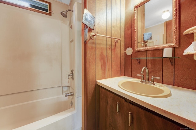 bathroom featuring vanity and washtub / shower combination