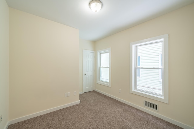 view of carpeted spare room