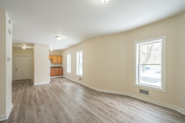 unfurnished living room with light wood-type flooring