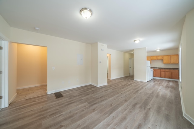 unfurnished living room with light wood-type flooring