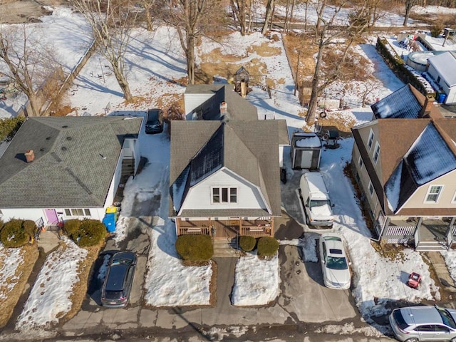 snowy aerial view featuring a residential view