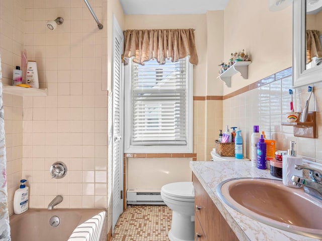 full bathroom with toilet, vanity, tile walls, baseboard heating, and shower / bath combination with curtain