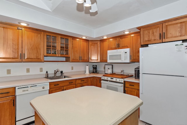 kitchen with ceiling fan, sink, and white appliances