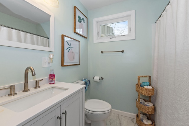 bathroom with vanity and toilet