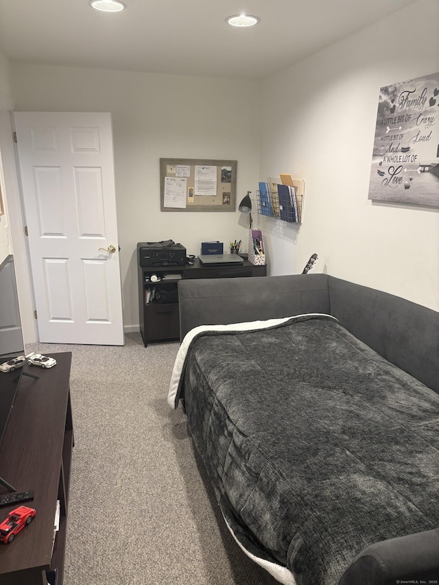 bedroom with light colored carpet