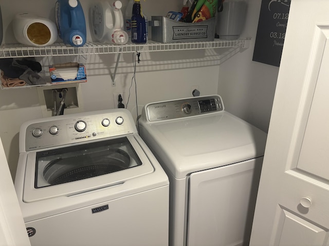 washroom with washer and dryer