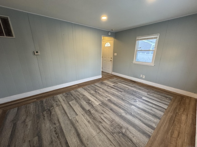 spare room featuring hardwood / wood-style flooring