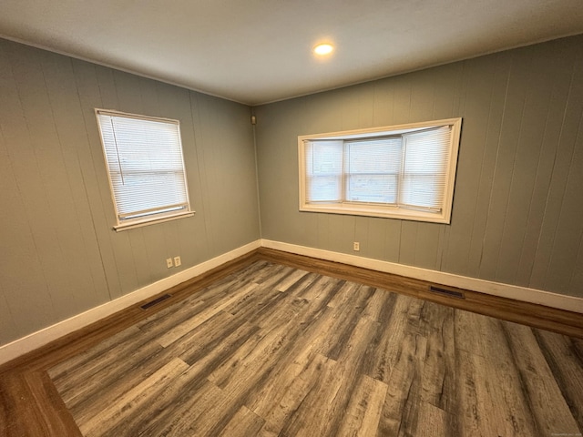 empty room featuring hardwood / wood-style flooring