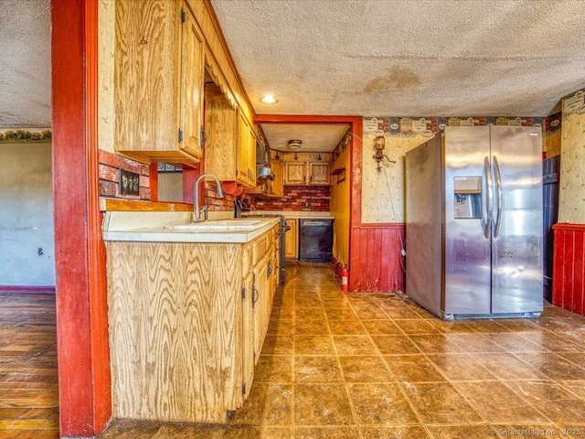 kitchen with range, dishwasher, stainless steel fridge with ice dispenser, and a textured ceiling