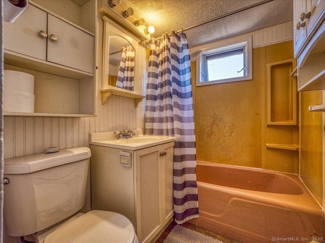 full bathroom with vanity, shower / bathtub combination with curtain, and toilet