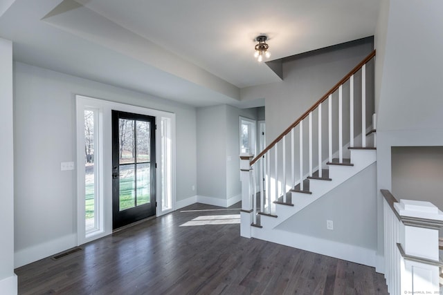 foyer entrance with dark hardwood / wood-style floors